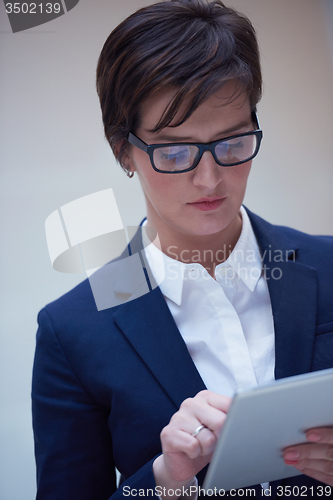 Image of business woman working on tablet