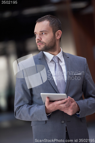 Image of business man with tablet