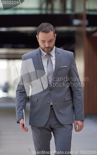 Image of business man with tablet
