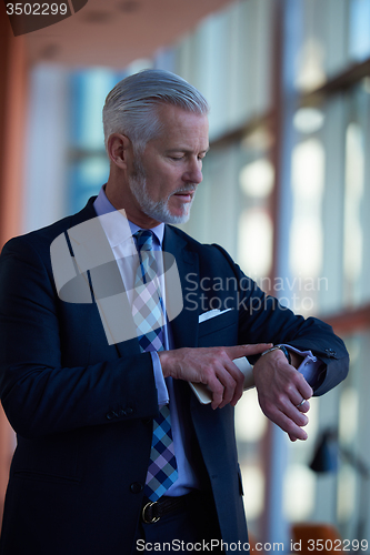 Image of senior business man talk on mobile phone