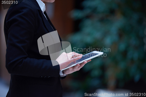 Image of business woman working on tablet