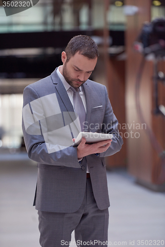 Image of business man with tablet