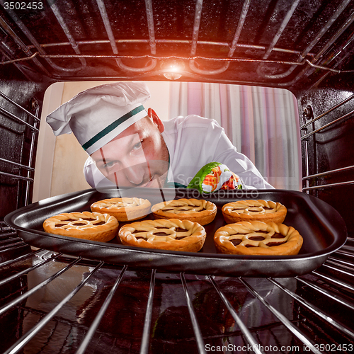 Image of Chef cooking in the oven.