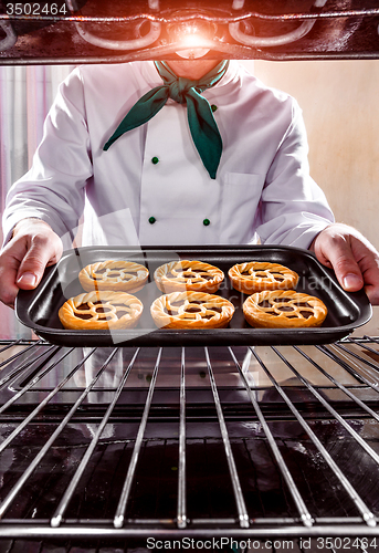 Image of Chef cooking in the oven.