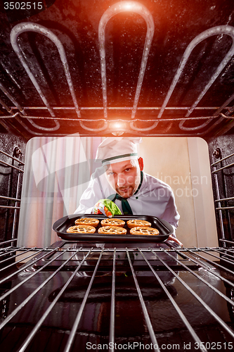 Image of Chef cooking in the oven.