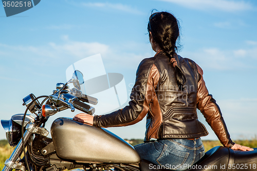 Image of Biker girl on a motorcycle