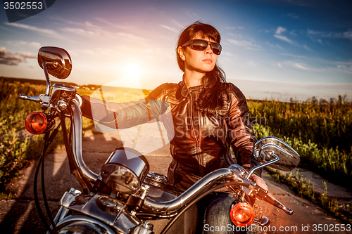 Image of Biker girl on a motorcycle