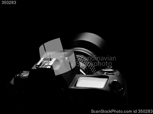 Image of SLR camera on black spot light