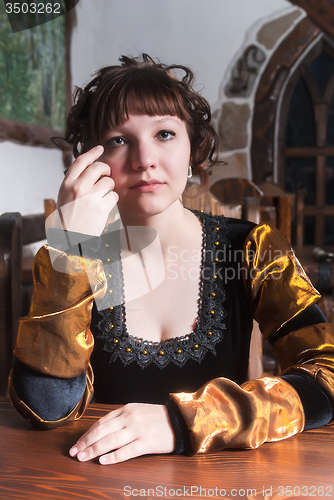 Image of Attractive woman in red dress in retro baroque style