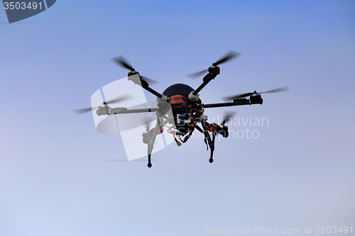 Image of flying drone with an octocopter for video and photo productions 