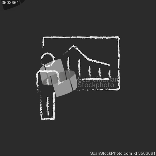Image of Businessman with infographic icon drawn in chalk.