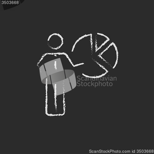 Image of Businessman pointing at the pie chart icon drawn in chalk.