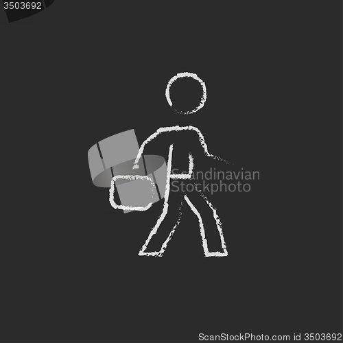 Image of Businessman walking with briefcase icon drawn in chalk.