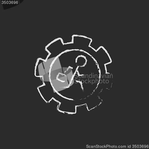 Image of Man running inside the gear icon drawn in chalk.