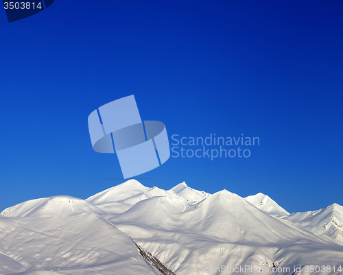 Image of Snowy mountains and blue clear sky  in morning