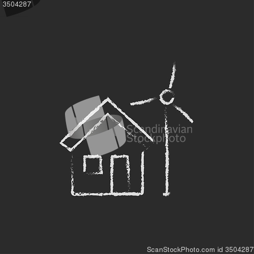 Image of House with windmill icon drawn in chalk.