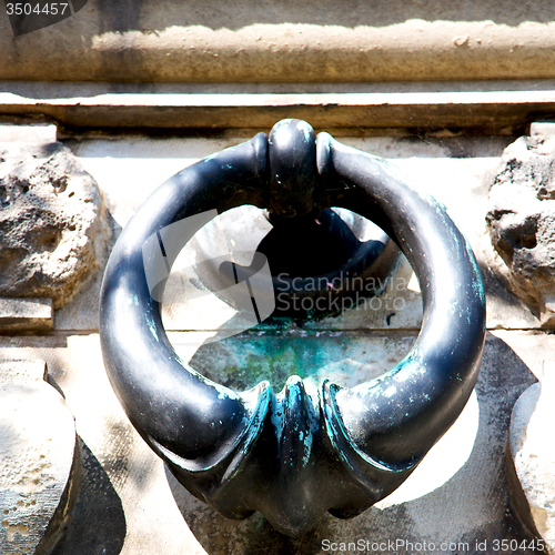 Image of blue   handle in london antique concrete  rusty  brass nail and 