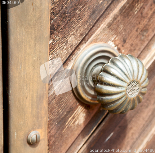 Image of stripped paint  door    in italy   ancian wood and traditional  
