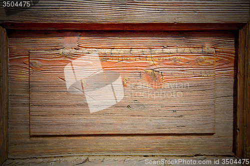 Image of grain texture of a brown antique wooden old door in italy   euro