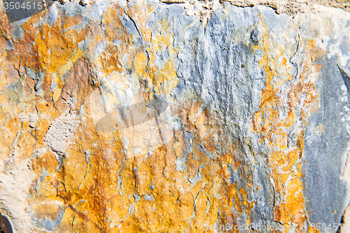 Image of rocks stone and red orange  in the wall of morocco