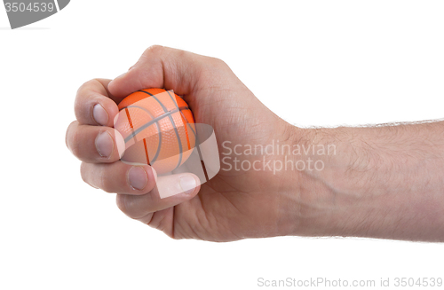 Image of Isolated hand with a mini basket ball 