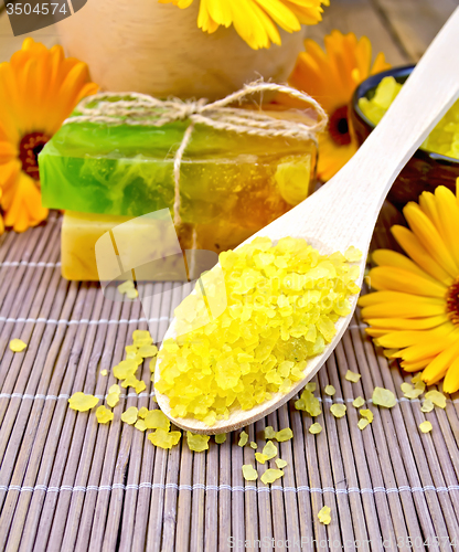 Image of Salt yellow and soap with calendula on bamboo