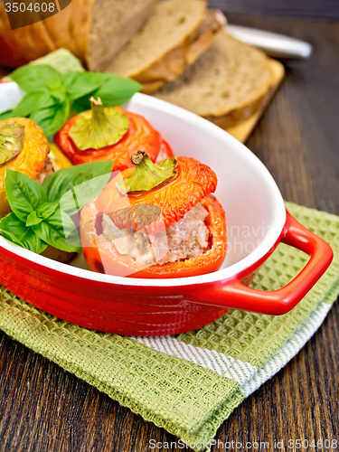 Image of Pepper stuffed meat in red roaster on table