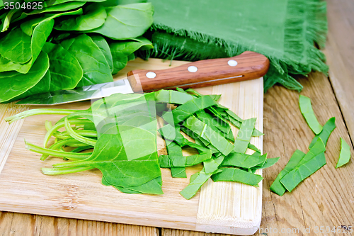 Image of Spinach shredded with knife on board