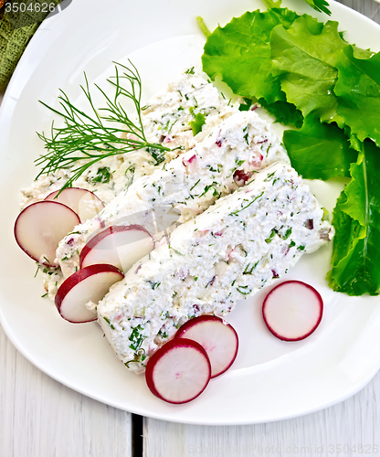 Image of Terrine of curd and radishes in dish on board top