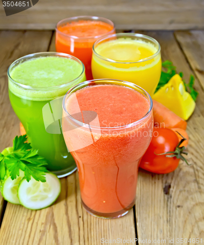 Image of Juice tomato and vegetable in glassful on board