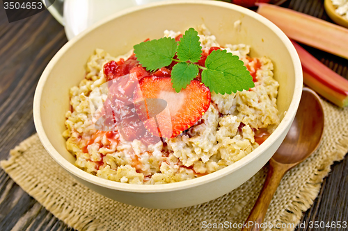 Image of Oatmeal with strawberry-rhubarb sauce on board