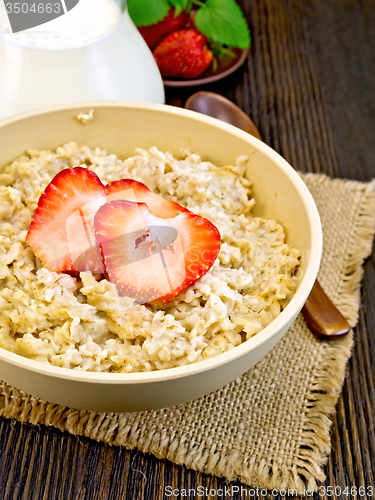 Image of Oatmeal with strawberry on board
