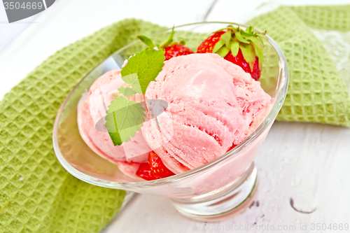 Image of Ice cream strawberry in glass on board