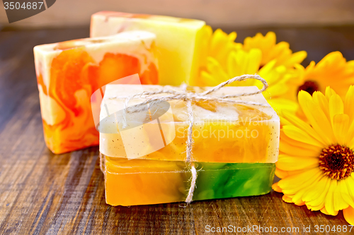 Image of Soap homemade with calendula on board
