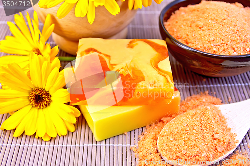 Image of Soap homemade and salt with calendula on bamboo