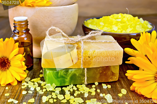 Image of Soap homemade and salt with calendula on board