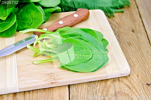 Image of Spinach with knife on board