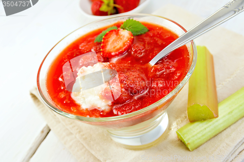 Image of Dessert strawberry-vanilla and rhubarb in glassful on napkin