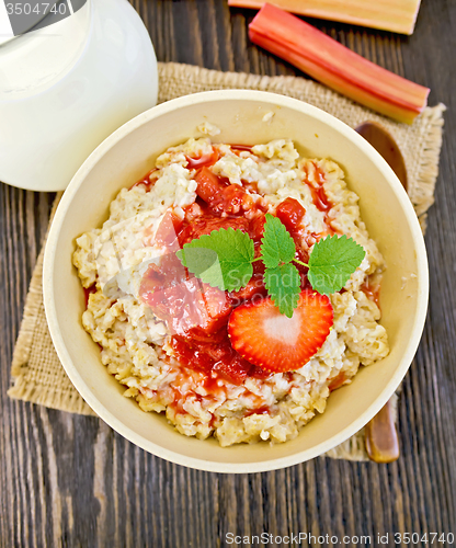 Image of Oatmeal with strawberry-rhubarb sauce on board top