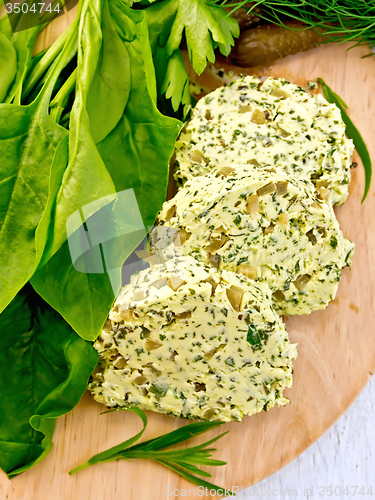 Image of Butter with spinach and greens on board