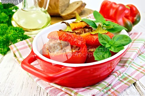 Image of Pepper stuffed meat in red roaster on light board