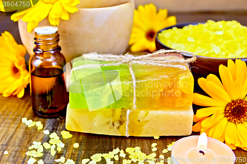 Image of Soap homemade and oil with calendula on board