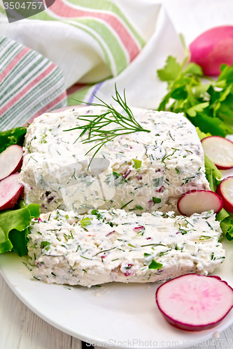 Image of Terrine of curd and radishes in dish on board