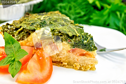 Image of Pie celtic with spinach in dish on table