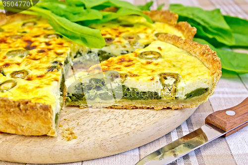 Image of Pie with spinach on the tablecloth