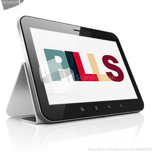 Image of Healthcare concept: Tablet Computer with Pills on  display