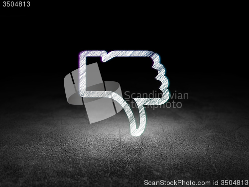 Image of Social media concept: Thumb Down in grunge dark room