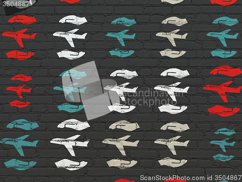 Image of Insurance concept: Airplane And Palm icons on wall background