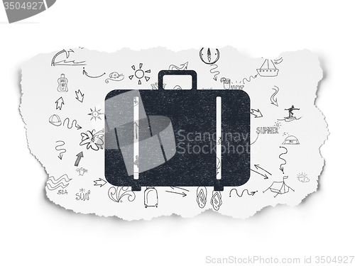 Image of Travel concept: Bag on Torn Paper background