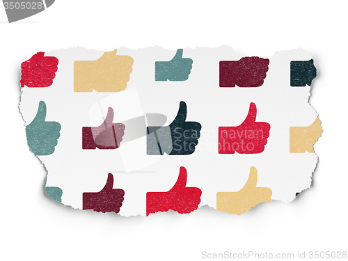 Image of Social media concept: Thumb Up icons on Torn Paper background